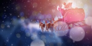 Santa driving his sleigh and reindeer through a snowy, foggy night.