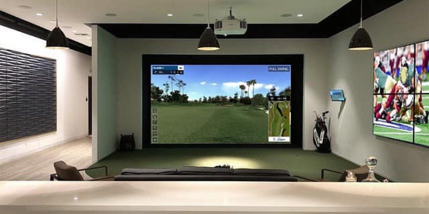 A large screen in an indoor golf simulator.