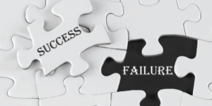 A white puzzle is nearly complete, with one piece missing that says "success." The blank spot in the puzzle says, "failure."