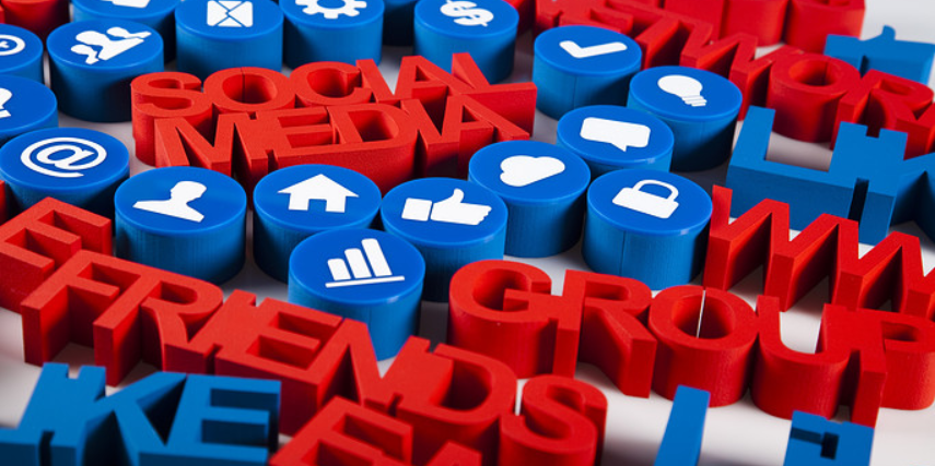 A jumble of blue, white and red 3D social media icons.