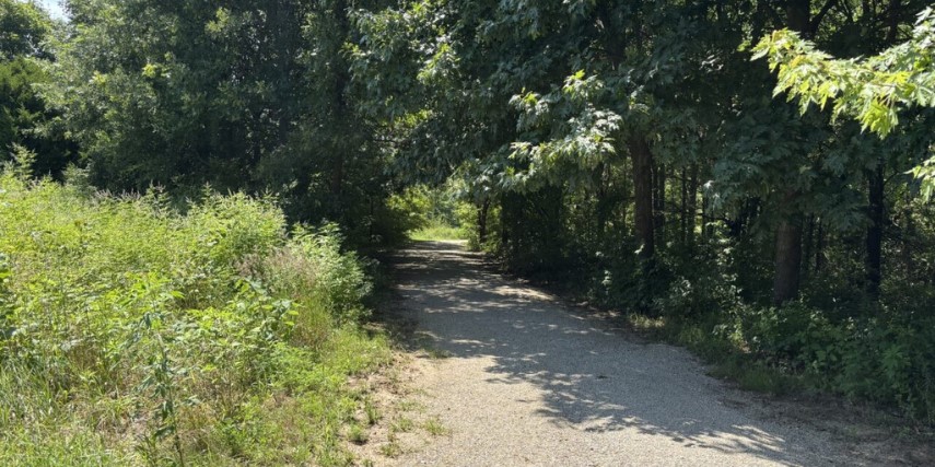 View of a shaded packed gravel trail within St. Joseph's extensive trail systems. 