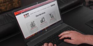 Close-up of a laptop showing a business website.