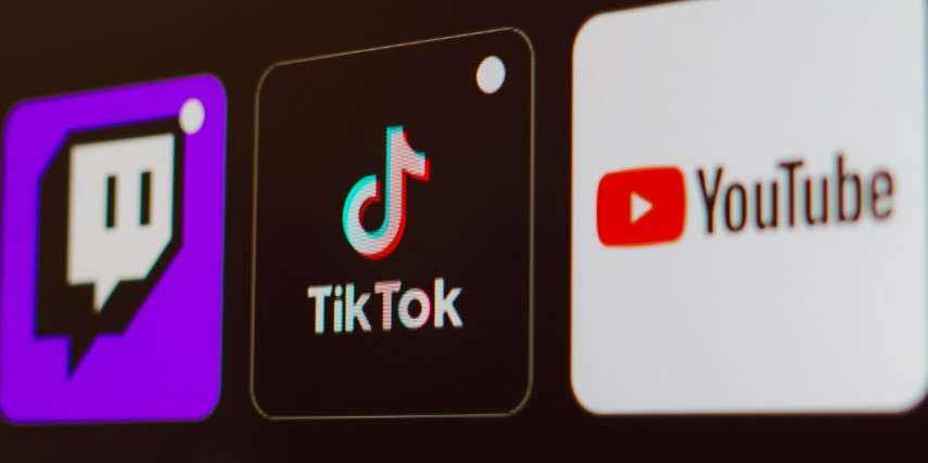 Three social media app logos against a black screen background.