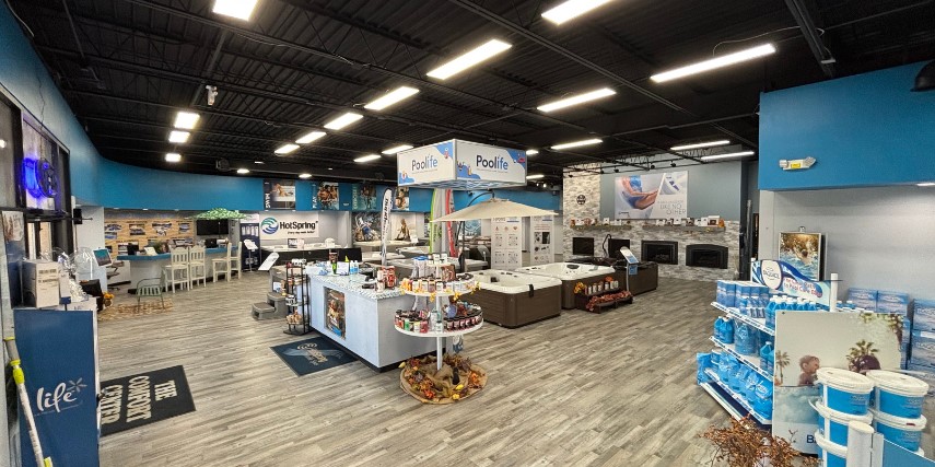 Interior view of The Comfort Center, with racks of supplies displayed in a large showroom.