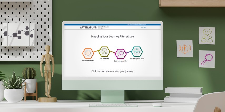 A desktop computer monitor shows an interactive map on a website.