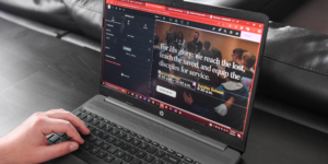 A web developer works on a website design for a private school.