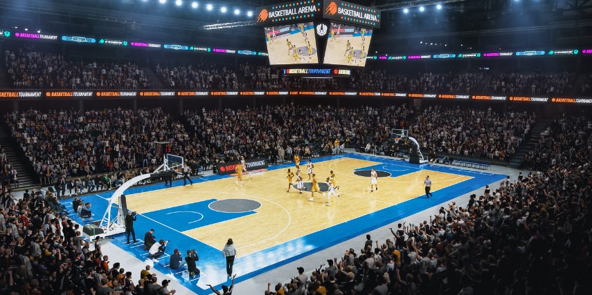 Large college basketball arena filled with fans watching a game.