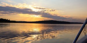 The sun shines on the surface of Truman Lake at Harry S Truman State Park, with a lovely sky in the background.
