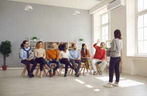 Woman presenting for corporate staff in coworking space office