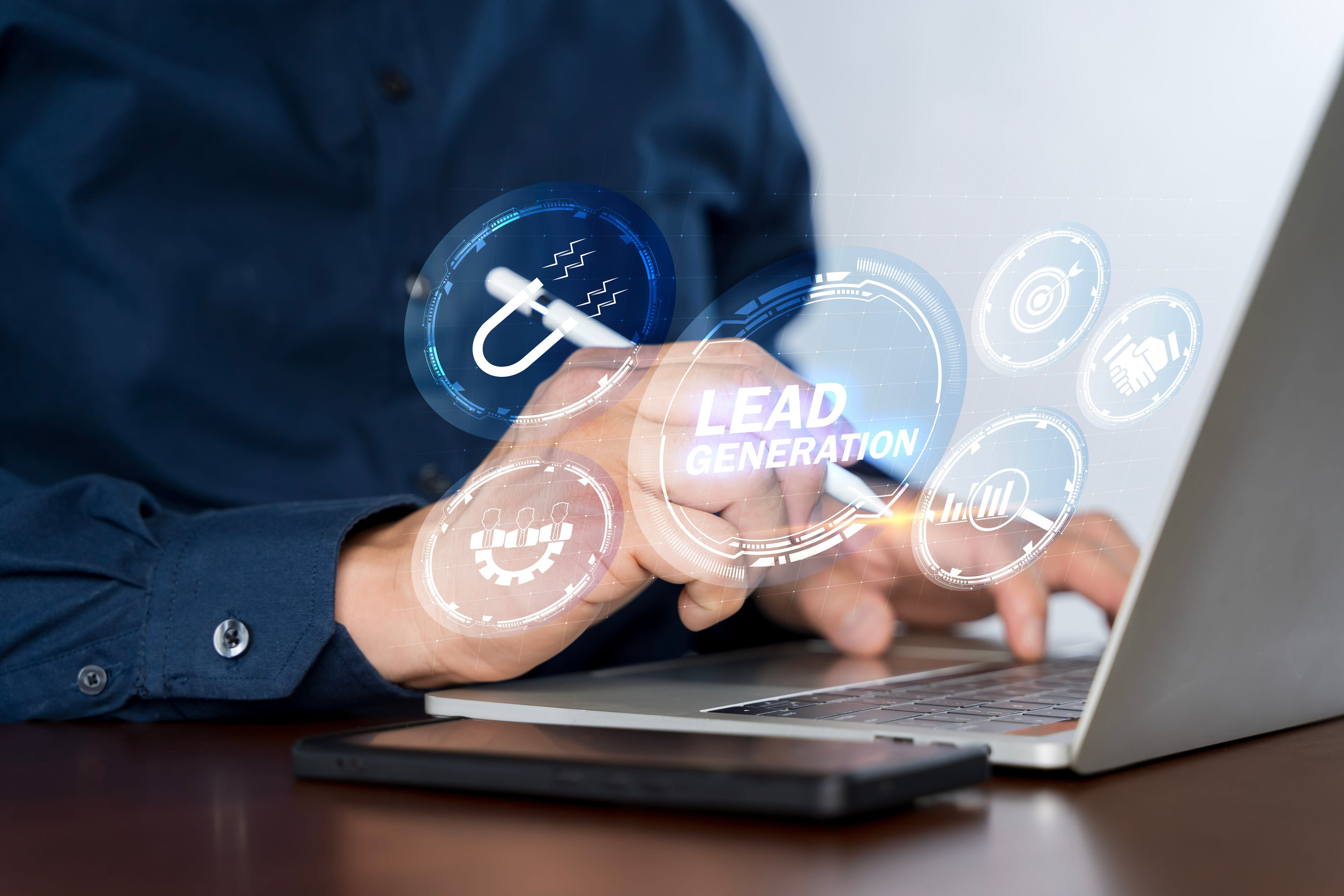 Businessman using laptop with lead generation icon on virtual screen.