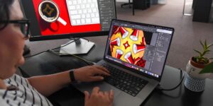A graphic designer works on designs for a digital campaign.