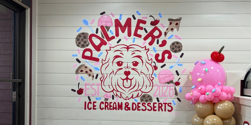 Palmer's Ice Cream logo is featured on the wall of the shop.