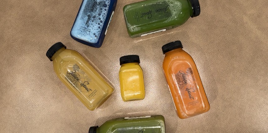 5 different juice flavors in Juice Stop bottles.